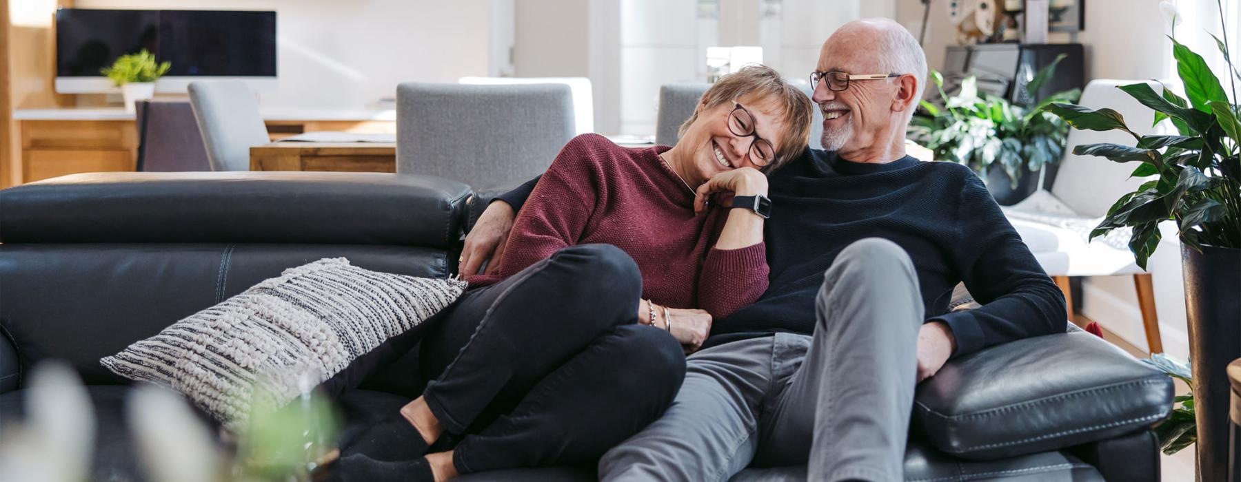 a man and woman sitting on a couch