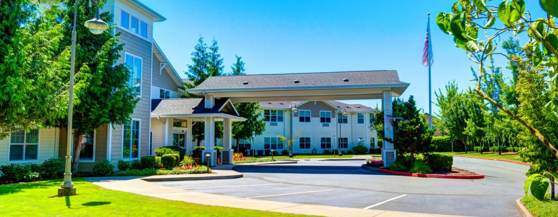 a building with a flag and trees